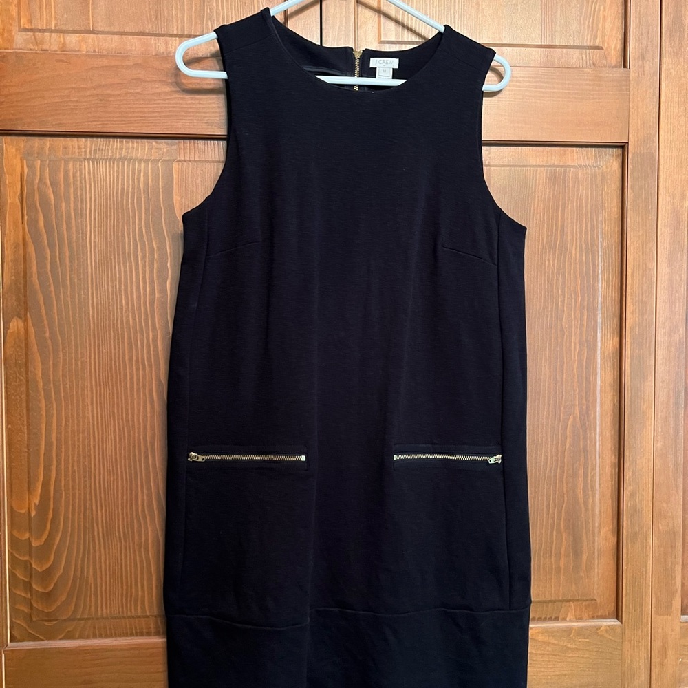 J Crew jumper with cute pockets that zip. Matching zipper detail on backside